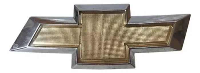 Emblema Parachoque Dianteiro Onix Joy 2013 - 2018 Prateado