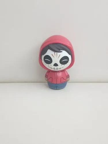 Boneco Miniatura Viva a vida e uma festa Miguel Brilha no escuro