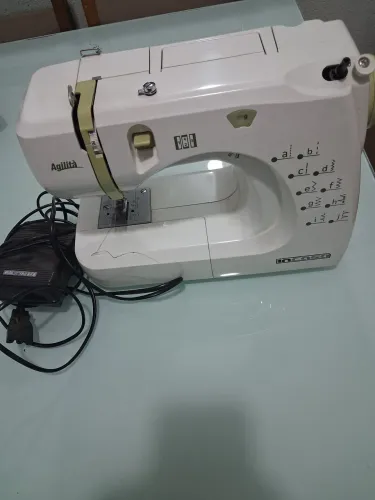 Máquina de costura elétrica portatil