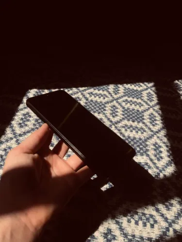 Celular Redmi 14c, semi novo, apenas com trincado na parte traseira