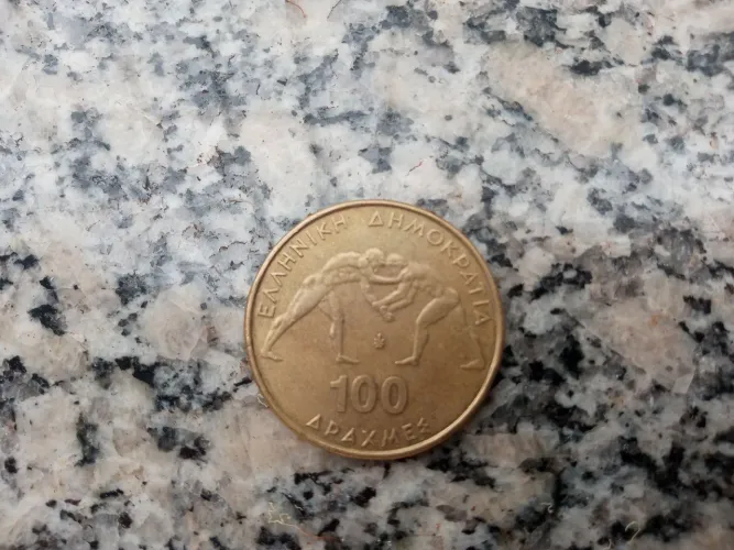 RARIDADE -  Moeda Comemorativa 100 DRACHMAS - LUTA GRECO-ROMANA (1999)<br>