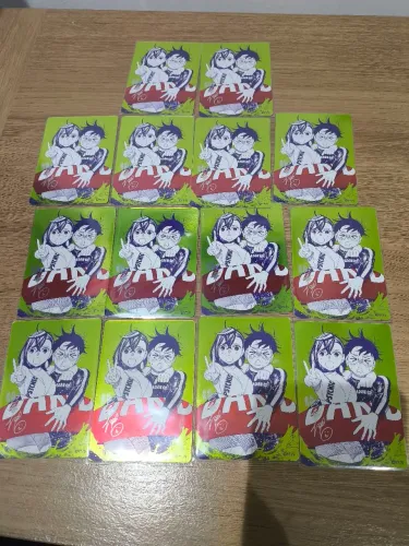 Dandadan NatsuComi 2026 - Card Metal Kira Promocional