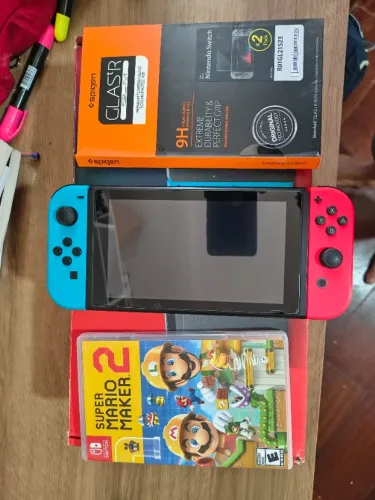 Nintendo switch + Mario maker 2 + duas películas.
