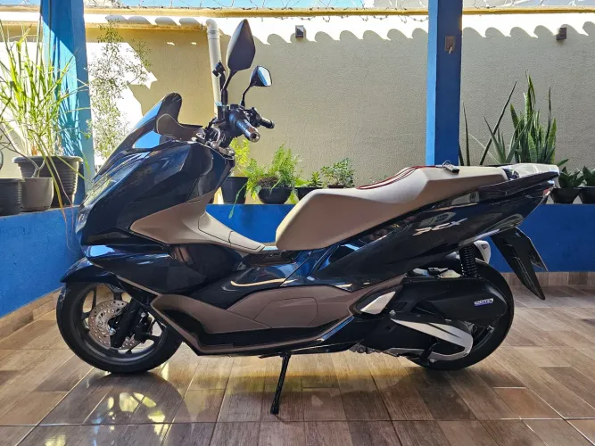 Moto de mulher Excelente