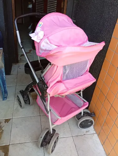 Carrinho e bebê conforto feminino