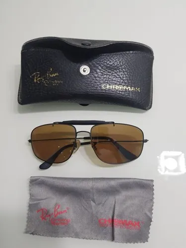 <br><br>Óculos Caçador Preto Lentes Ambar