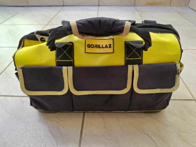 Bolsa de lona pra carrega ferramentas.