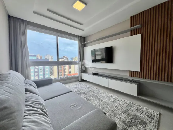 Apartamento de 2 dormitórios (sendo 1 suíte) mobiliado com box/vaga de garagem no Centro d