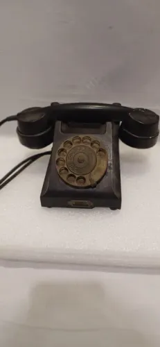 Telefone antigo de baquelite e disco de bronze da Ericson raro!