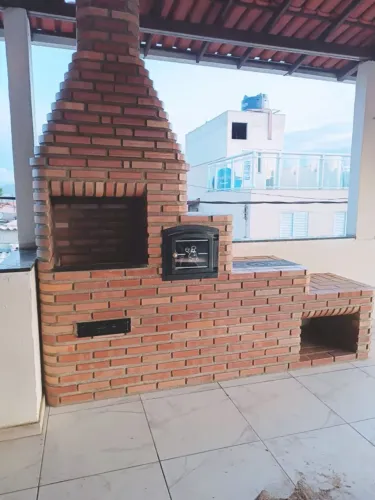 Fogão de lenha e churrasqueira de tijolinho