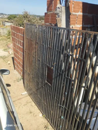 Grade de proteçao de loja com abertura para atendimento(serve como portão de garagem