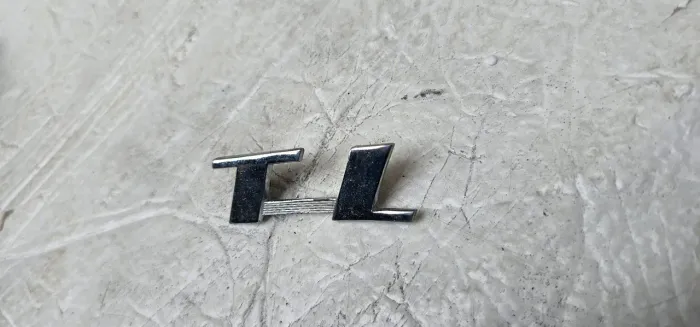 Tl emblema tampa traseira novo
