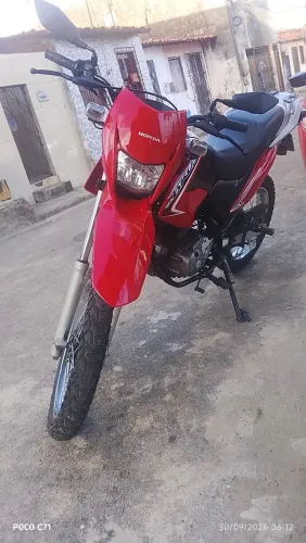 Troco Bros 125 2013 em carro