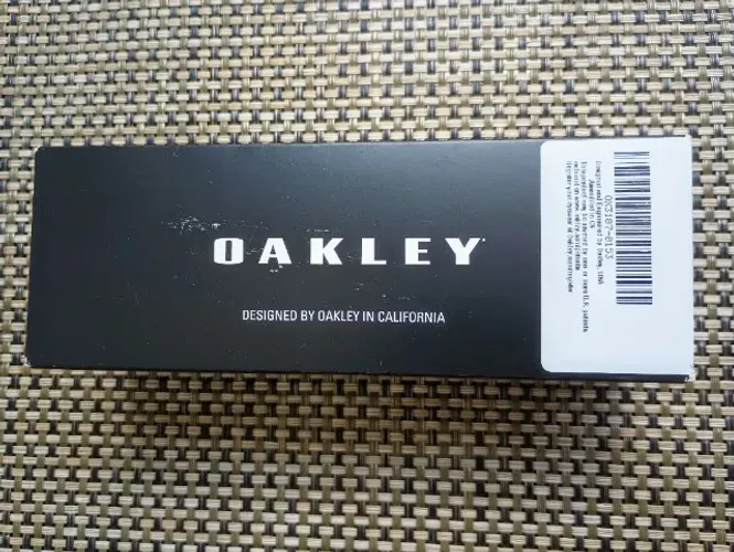 Armação Oakley prata novo na caixa