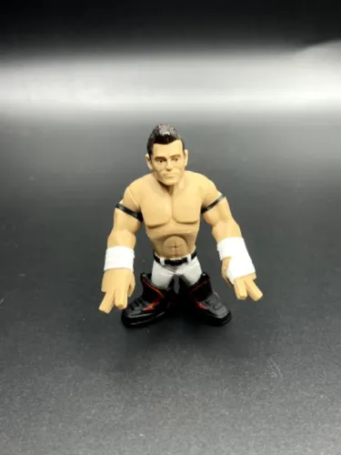 BONECO MINIATURA MATTEL WWE RUMBLERS EVAN BOURNE 7CM