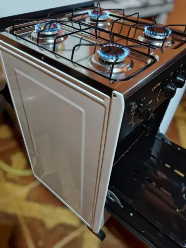 Fogão semi novo elétrico até entrego lê a descrição