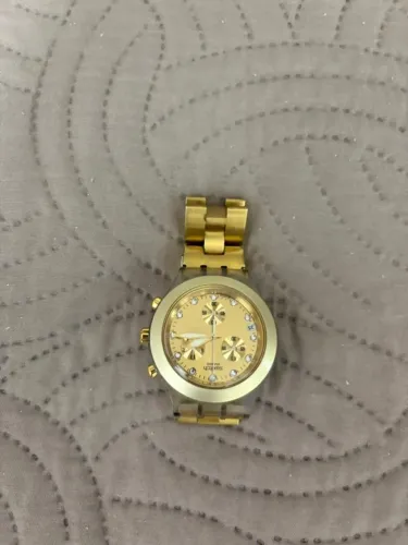 RELOGIO DOURADO SWATCH