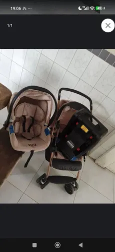 Carrinho de bebê com bebê conforto
