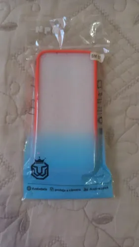 Capinha celular laranja SM S7 nova.