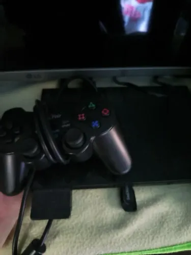 Playstation 2 em bom estado e rodando disco