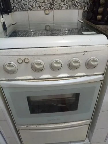 Fogão antigo de lata tudo funcionando motivo mudança 