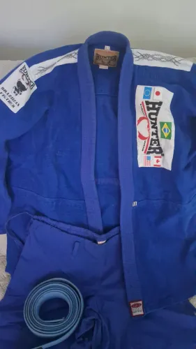 Kimono hunter azul specia ,l adulto novo sem uso, vai com faixa completo.