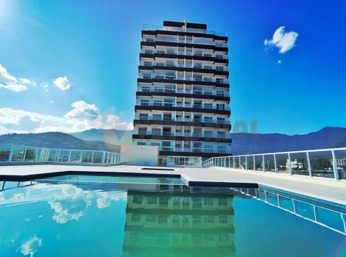 Apartamento com 3 dormitórios para alugar, 98 m² por R$ 5.500,00/mês - Massaguaçu - Caragu