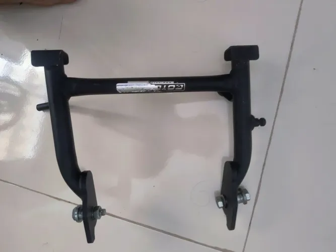 Descanso central FZ25 / MARCA COYOTE