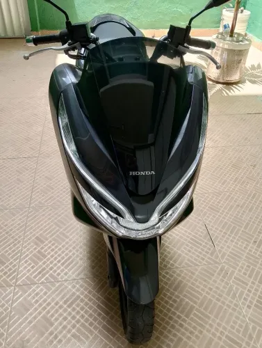 Moto único dono, de garagem 