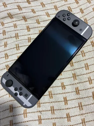 NINTENDO SWITCH OLED - EDIÇÃO ESPECIAL SUPER SMASH BROS. ULTIMATE