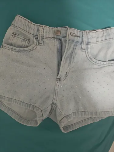 Short Jeans infantil feminino com aplicação em strass
