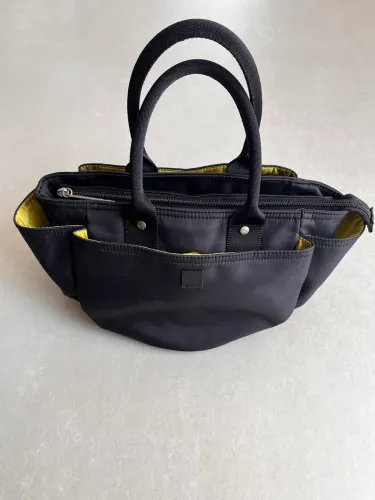 Bolsa de mão Uncle K preta 