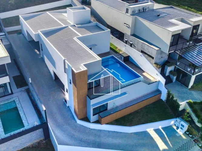 Casa com 5 dormitórios à venda, 370 m² por R$ 5.400.000,00 - Condomínio Reserva do Parateh