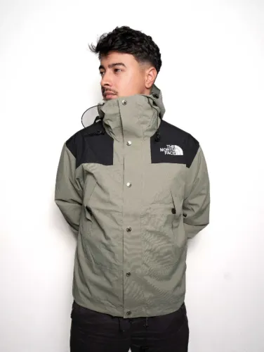 Jaqueta corta vento masculina the north face verde musgo e preto