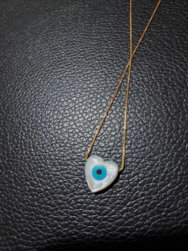 Vendo gargantilha banhada a ouro 18k com pingente de olho grego em forma de coração 45 cm