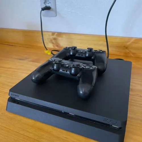 PLAYSTATION 4 COM 2 CONTROLES E 7 JOGOS