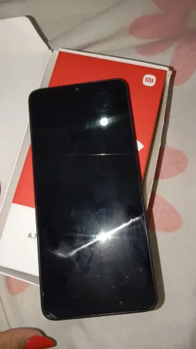 Celular Redimi 13C 900,00 com caixa , não vai carregar, apenas um tricô na tela