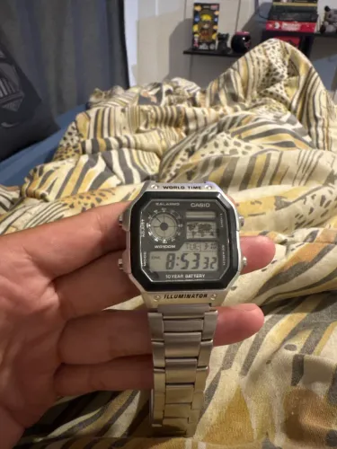 Relógio Casio AE-1200WHD-1 Masculino Word Time Prata Quadrado Cor da correia Prateado