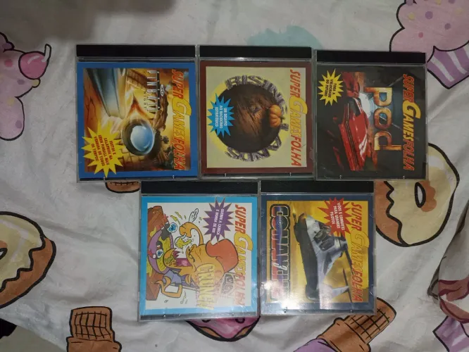Lote de CDs antigos de jogos para PC - Super Game Folha, Pokémon e outros