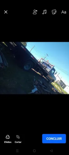 Caminhão plataforma pego brique 