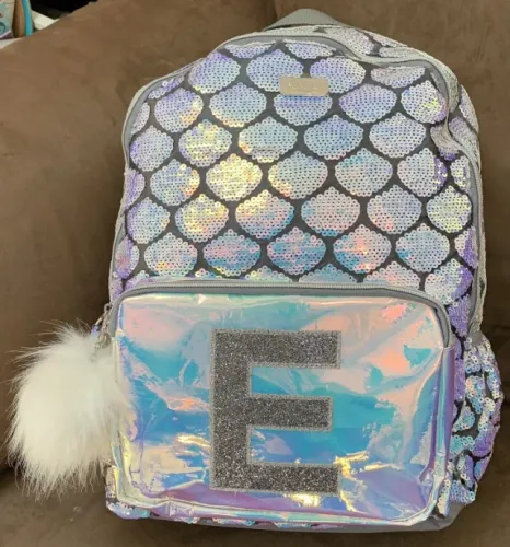 mochila de paetê lantejoulas sereia justice importado usa Letra E