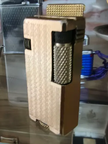 Isqueiro Penguin Cygnus mini gold anos 60 Japonesa