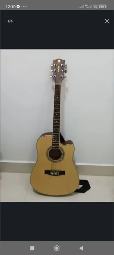 Violão eletroacústico Marquês. Inclue braçadeira, caderno de música e cordas de aço.