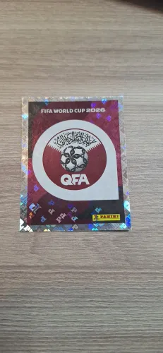 Figurinha Brilhante Escudo Qatar Álbum Copa 2026