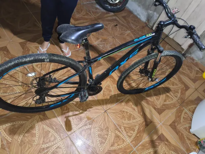Bicicleta OXS Glide 100 Aro 29 Shimano 21v Preto e Azul e S-lime