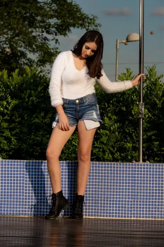 Blusa de plumas manga longa