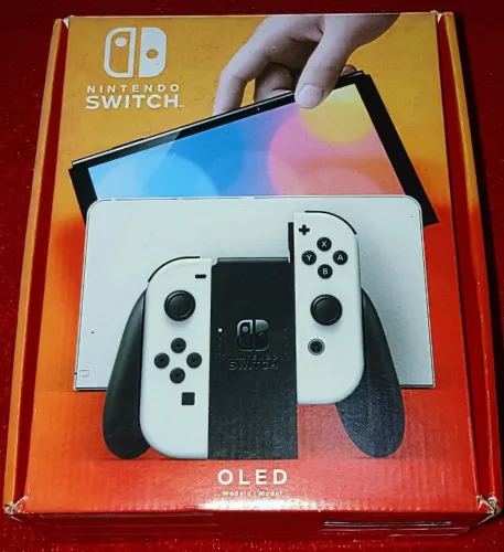 Caixa de Nintendo switch oled + manual+berço