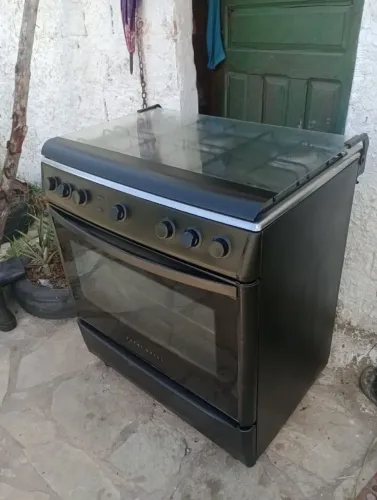 Fogão com grill, acendimento automático, facilito a entrega 