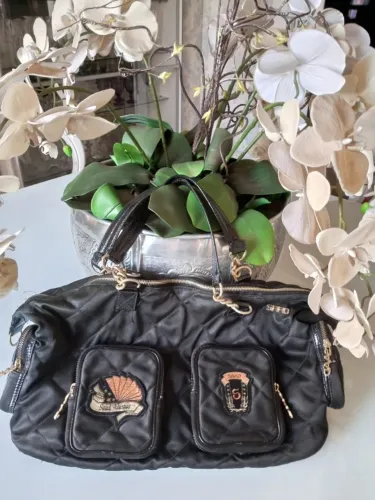 Bolsa matelassê preta Saad.