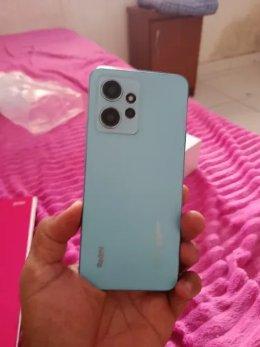 Celular redimi 12 bem novinho cem a arranhão